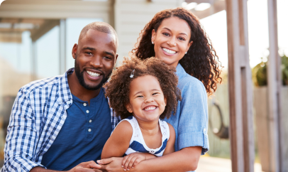 A smiling family with a child, representing the positive impact of healthcare solutions.